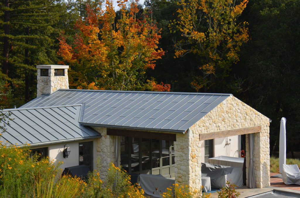 Image of French limestone structure with zinc roofing and gutters
