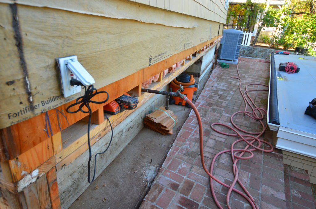 Image of a new foundation being installed under an existing wall