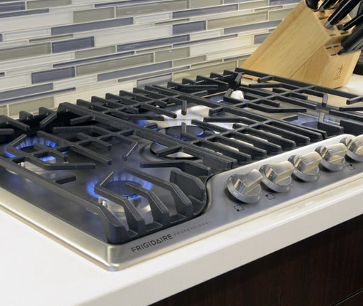 Image of 5 burner natural gas cooktops in chrome and black