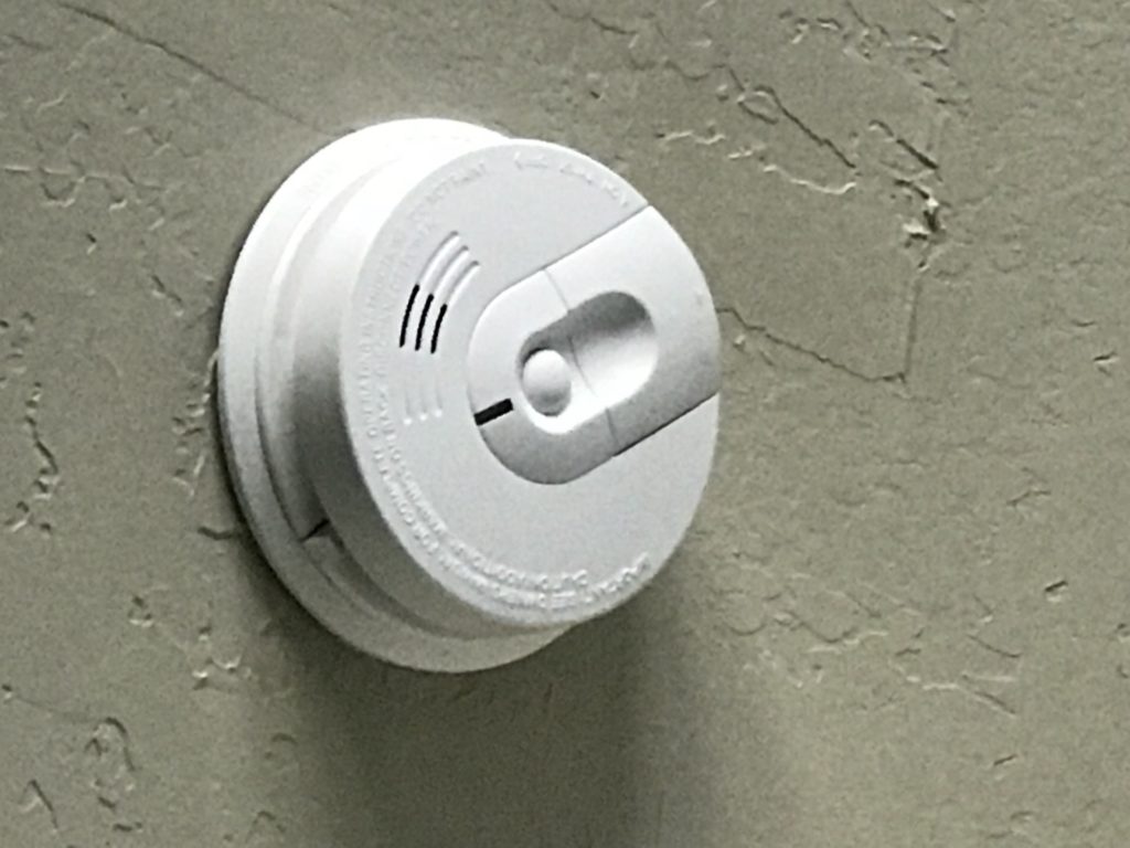 Smoke and CO detectors Image of smoke detectors mounted to ceiling