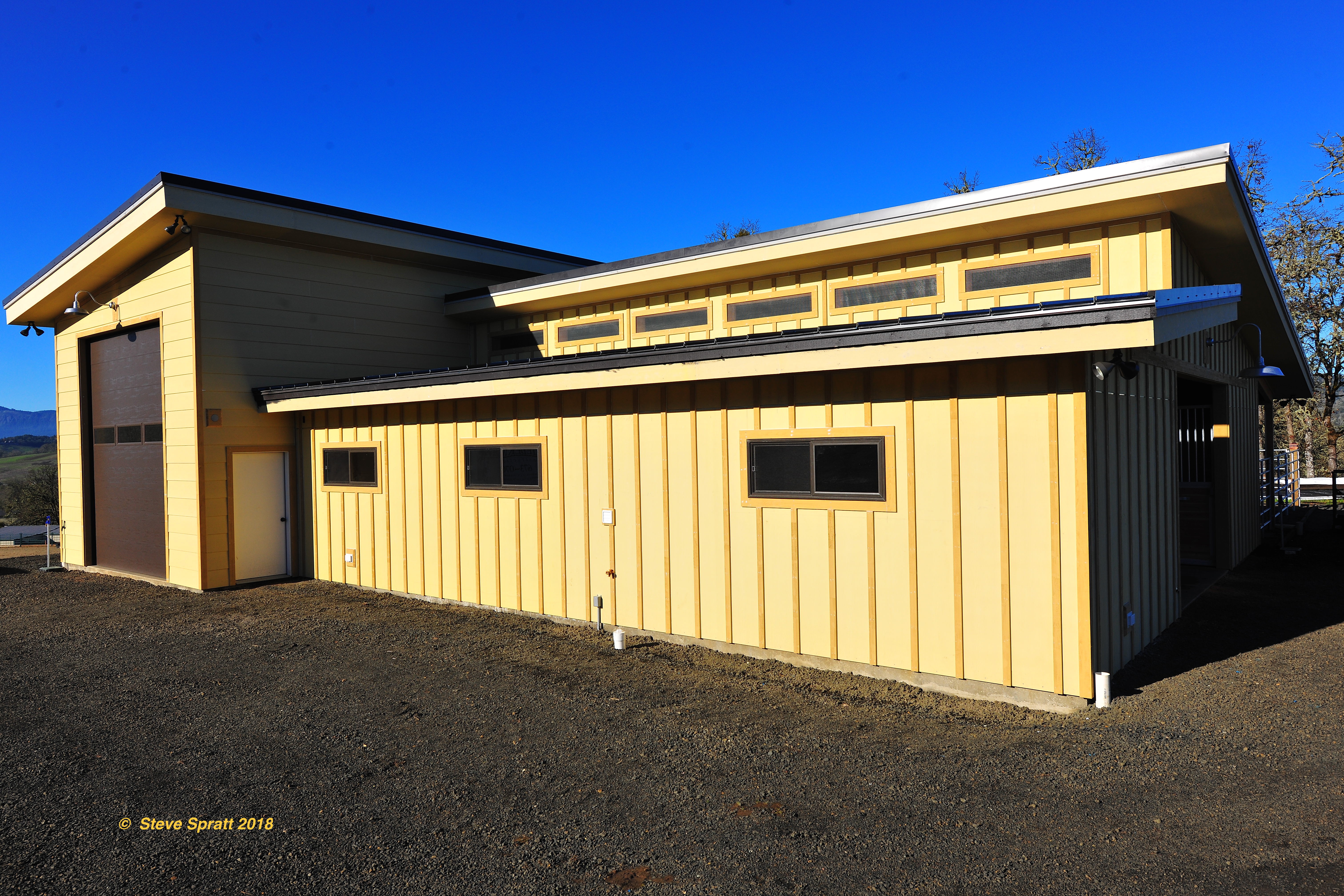 Inspection notes that caulking has failed along trim areas at the barn siding above and below the large side windows