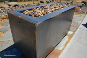 Image of rectangular fire pit made of cor-ten steel prior to rusting