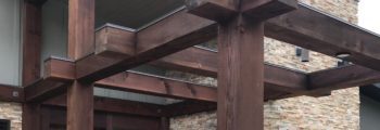 Inspection discovers that the stain has failed at entry exterior wood beams structure